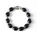 Bracelet noir et argent avec perle centrale – Élégance & caractère
