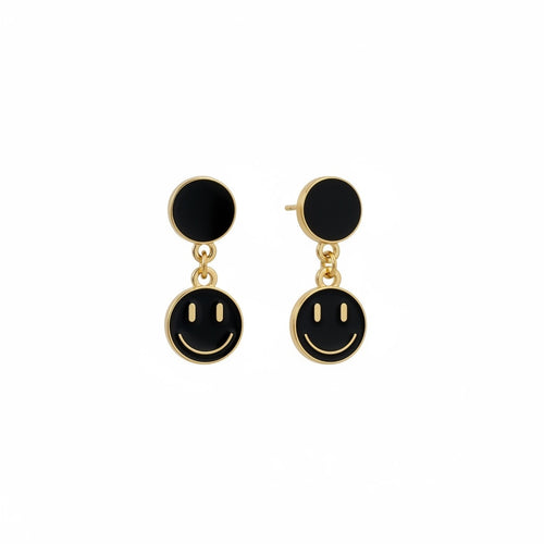 Boucles d'oreilles pendantes La boutique d'Emma dorées avec motif smiley en émail noir, design ludique et moderne.